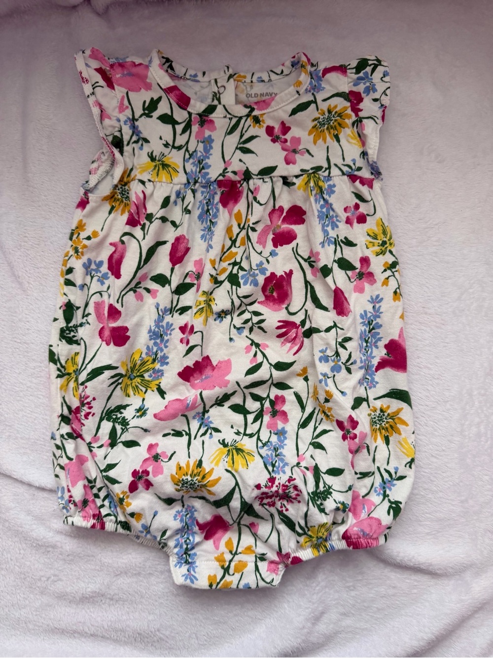 Old Navy White Floral Baby Romper with Pink, Yellow, & Blue Blossoms